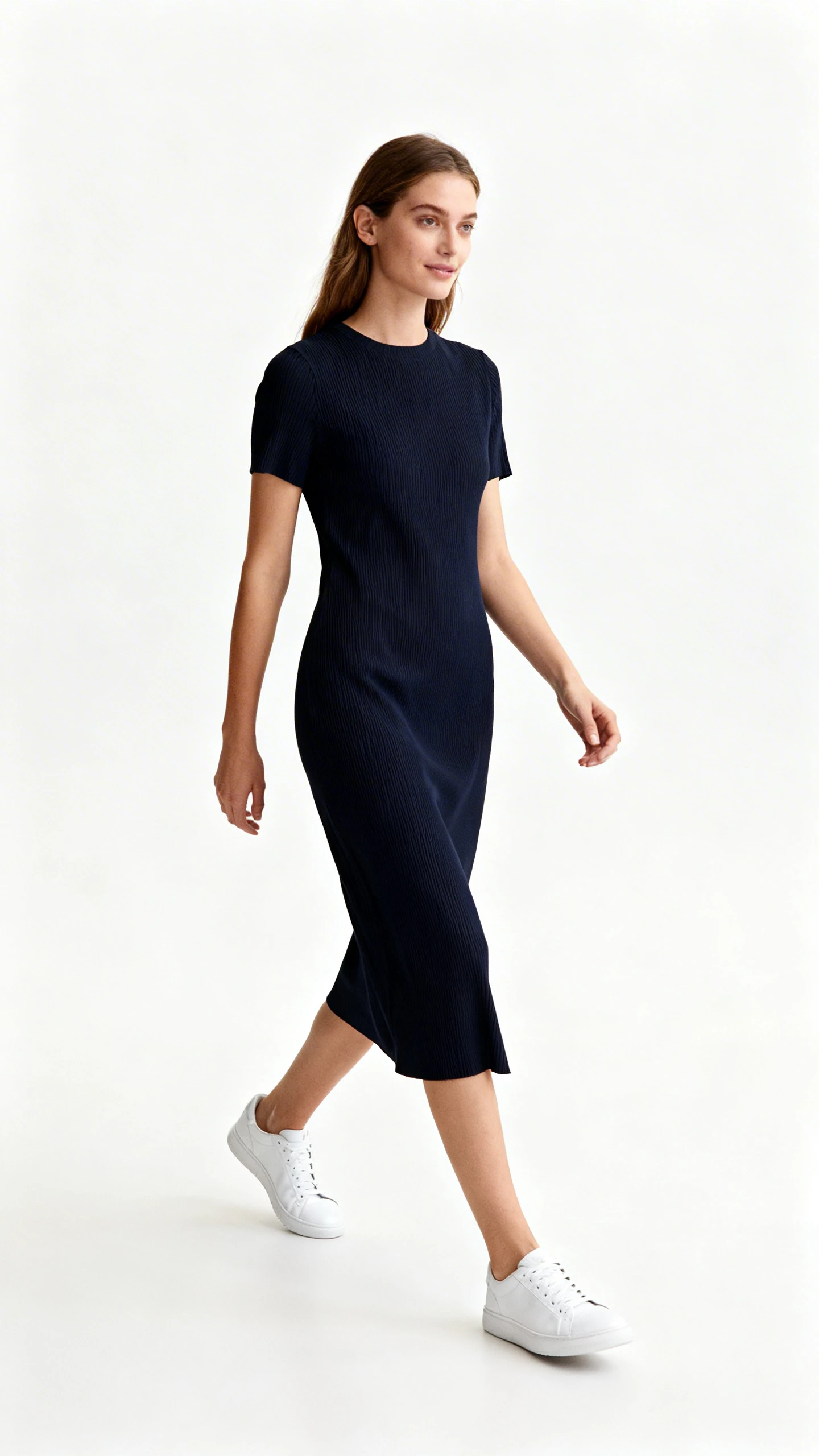 Editorial style photo of a woman wearing a midi dress paired with clean white sneakers, white background, soft lighting, minimal setting, slight walking motion, fashion photography style, clean and polished.
